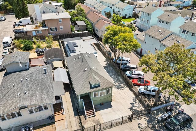 an aerial view of a houses with outdoor space