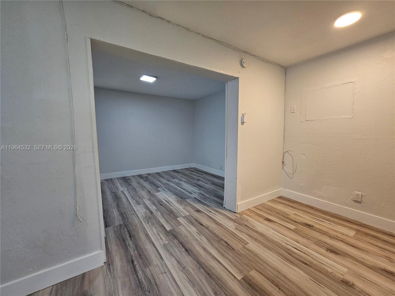 1727 Fletcher Street, Unit 1 Hollywood, FL 33020 - Photo 14 of 31 a view of hallway with wooden floor
