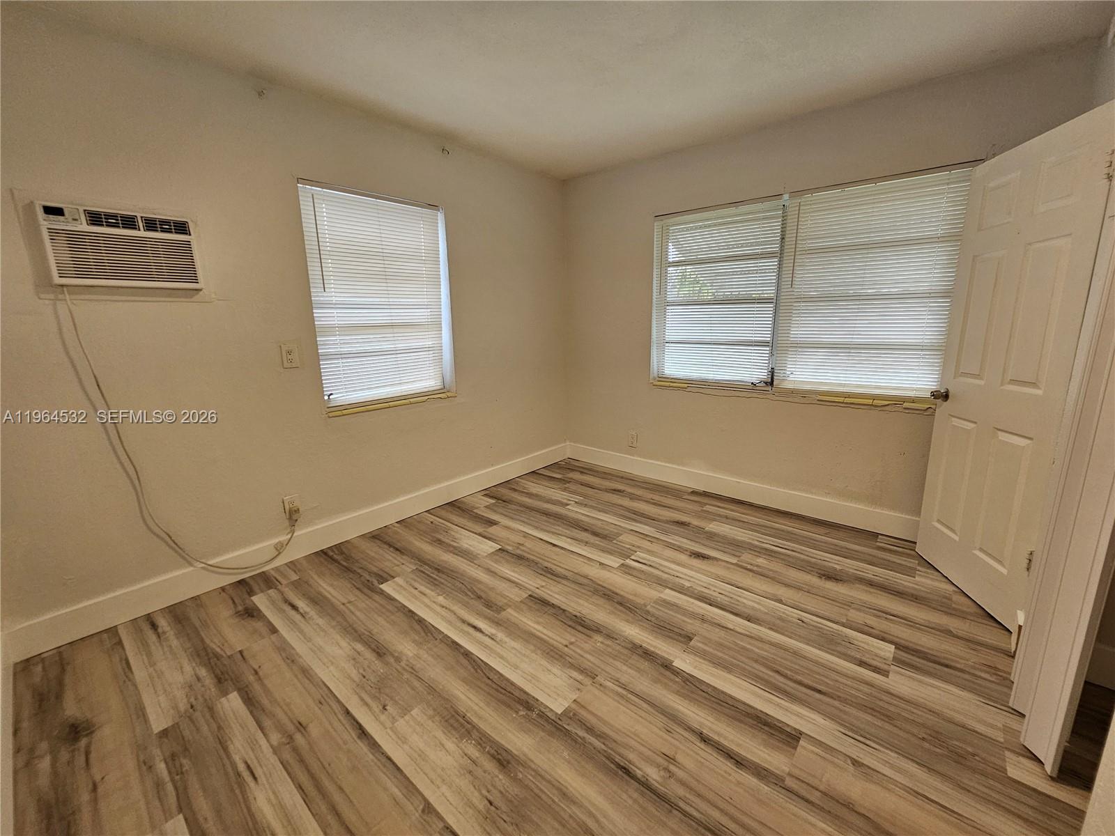 1727 Fletcher Street, Unit 1 Hollywood, FL 33020 - Photo 24 of 31 a view of empty room with wooden floor and fan