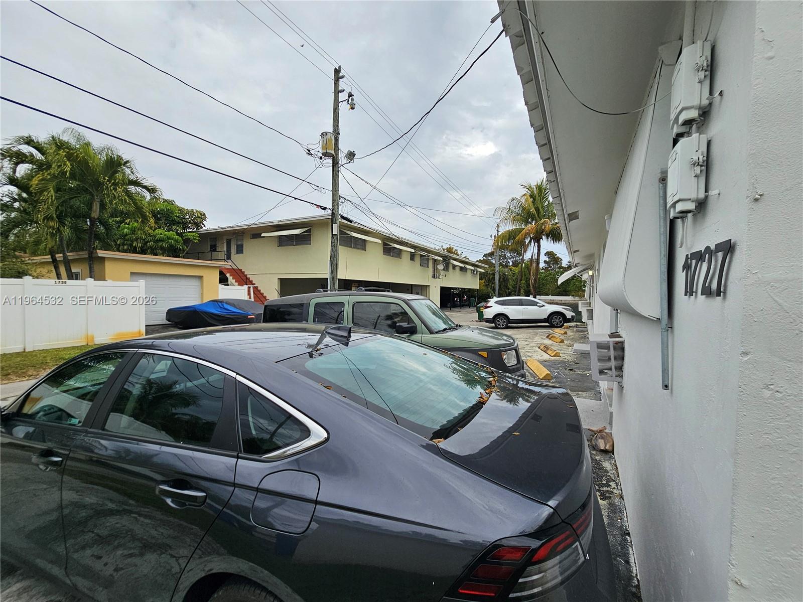 1727 Fletcher Street, Unit 1 Hollywood, FL 33020 - Photo 31 of 31 a kitchen with a sink a stove and a microwave oven