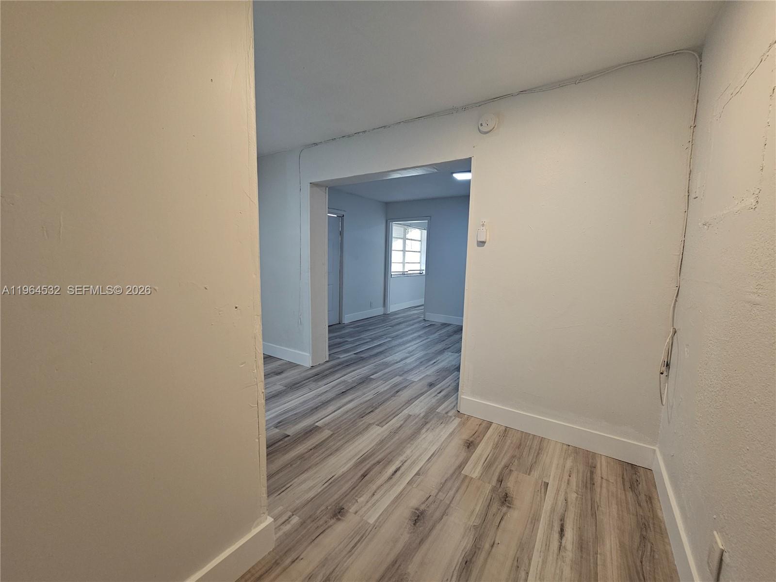 1727 Fletcher Street, Unit 1 Hollywood, FL 33020 - Photo 9 of 31 a view of a room with wooden floor