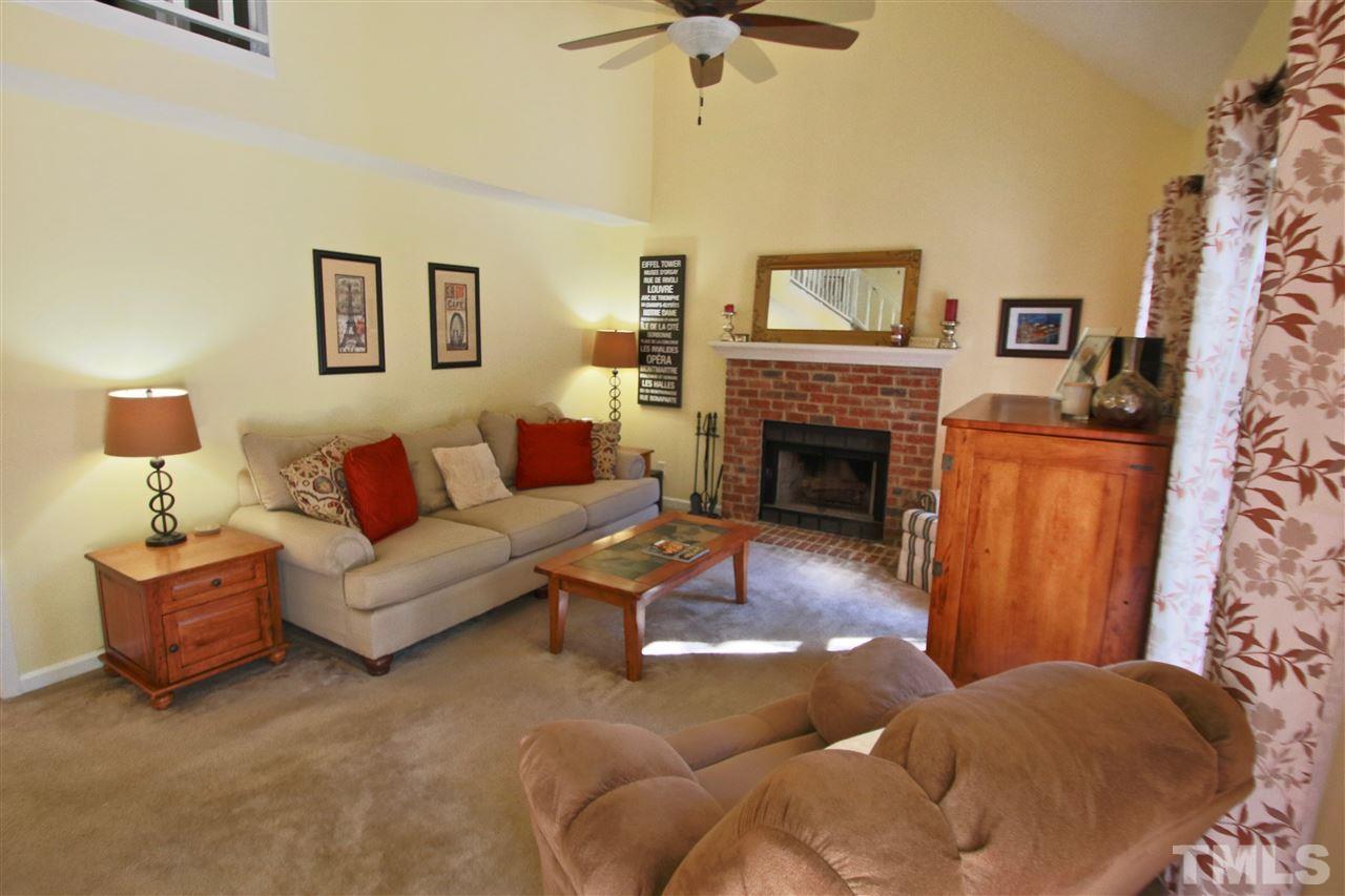 2349 Declaration Drive Raleigh, NC 27615 - Photo 5 of 25 a living room with furniture and a fireplace
