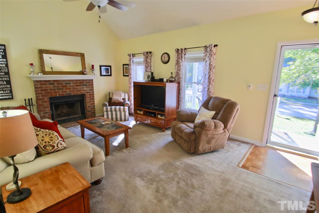 2349 Declaration Drive Raleigh, NC 27615 - Photo 6 of 25 a living room with furniture and a fireplace