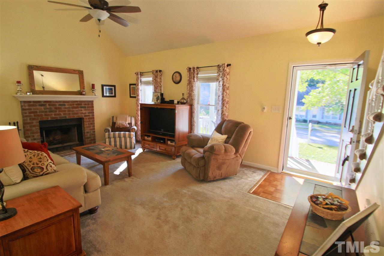 2349 Declaration Drive Raleigh, NC 27615 - Photo 7 of 25 a living room with furniture and a fireplace