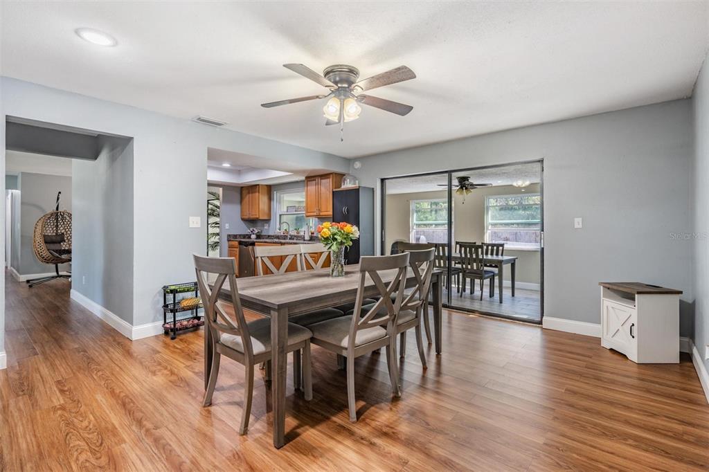 18631 San Rio Circle Lutz, FL 33549 - Photo 13 of 39 a view of a dining room with furniture and wooden floor