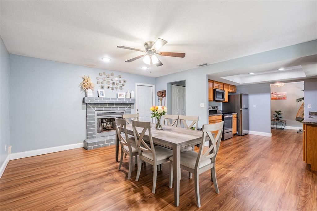 18631 San Rio Circle Lutz, FL 33549 - Photo 15 of 39 a view of a dining room with furniture and wooden floor