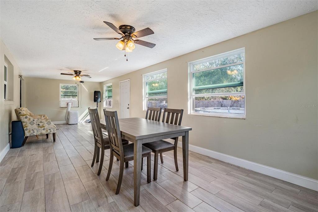 18631 San Rio Circle Lutz, FL 33549 - Photo 17 of 39 a view of a dining room with furniture and a window