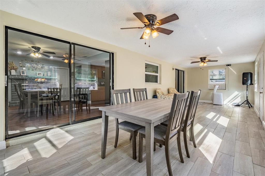 18631 San Rio Circle Lutz, FL 33549 - Photo 18 of 39 a view of a dining room and livingroom with furniture wooden floor and a chandelier