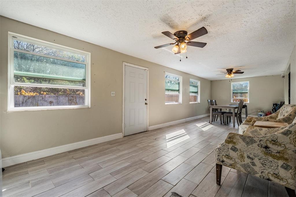 18631 San Rio Circle Lutz, FL 33549 - Photo 19 of 39 a view of a livingroom with furniture a ceiling fan and wooden floor