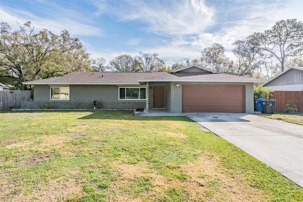 18631 San Rio Circle Lutz, FL 33549 - Photo 38 of 39 a front view of house with yard and swimming pool