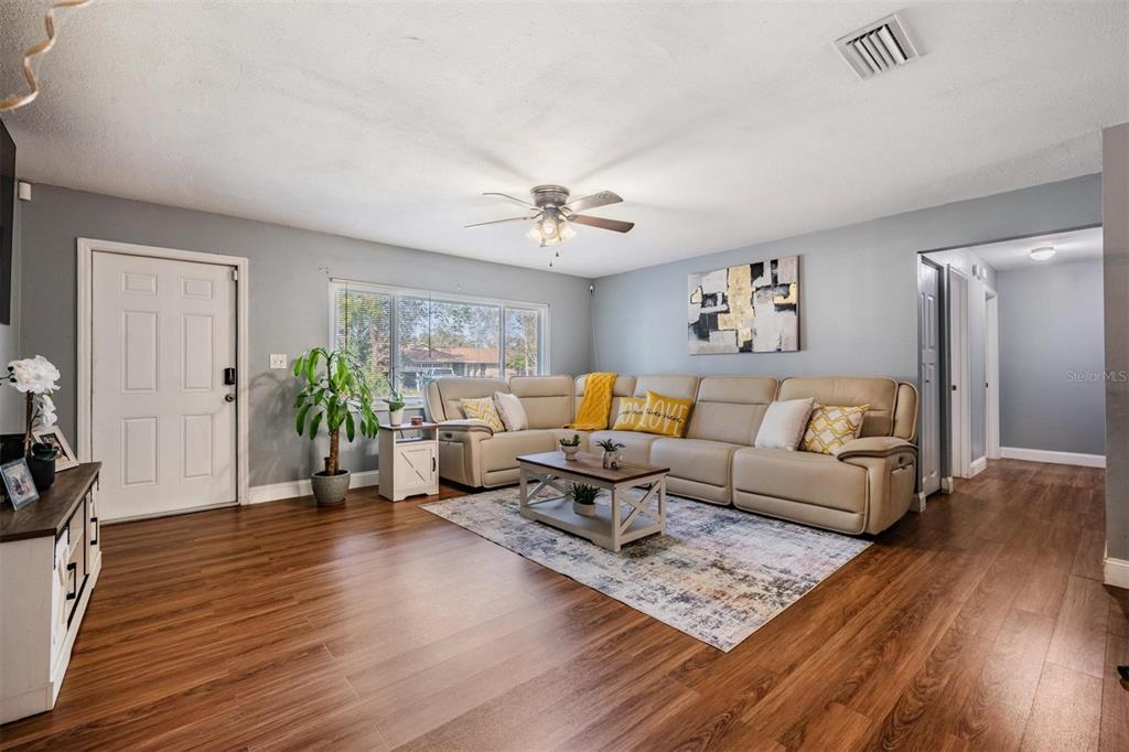18631 San Rio Circle Lutz, FL 33549 - Photo 4 of 39 a living room with furniture and a wooden floor