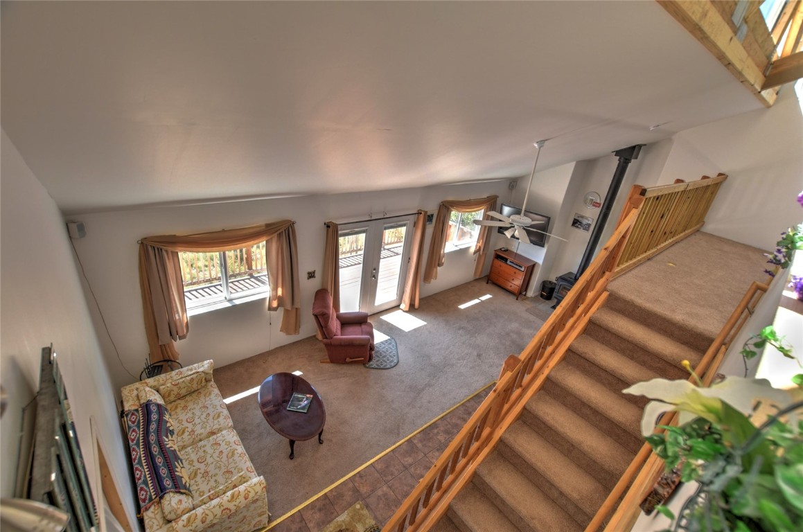 74 Noxibee Court Como, CO 80432 - Photo 8 of 31 a living room with furniture and a wooden floor