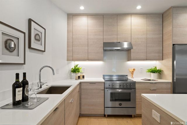 a kitchen with a stove and a sink