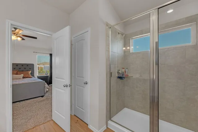 a bathroom with a shower and a sink