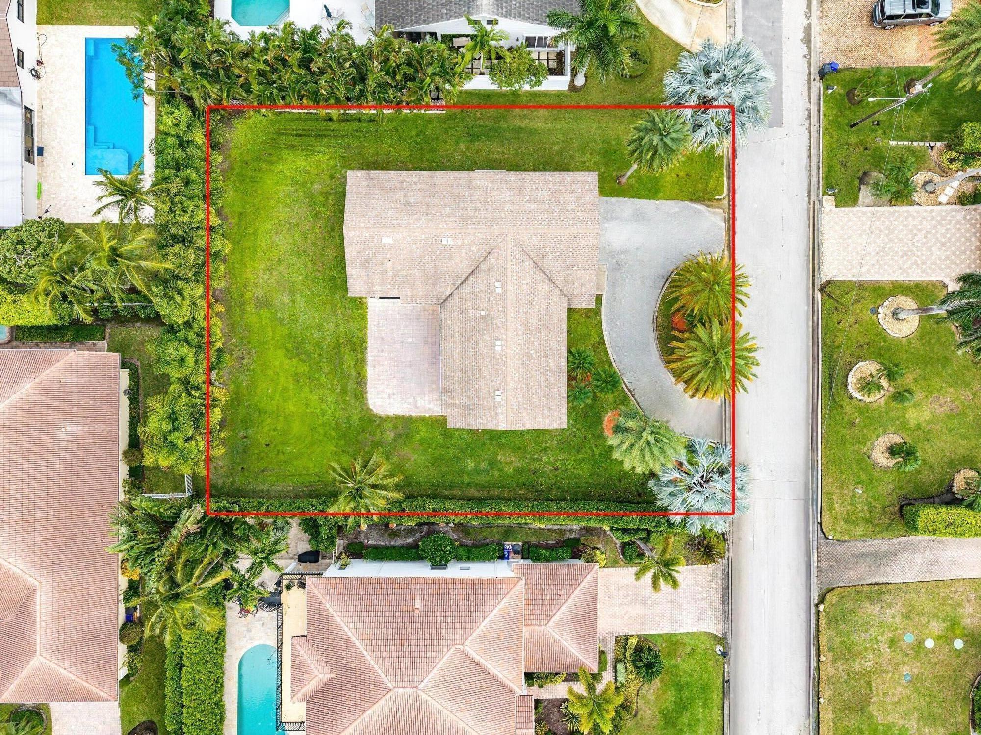 41 Bimini Cove Drive Ocean Ridge, FL 33435 - Photo 7 of 15 an aerial view of a house with a garden