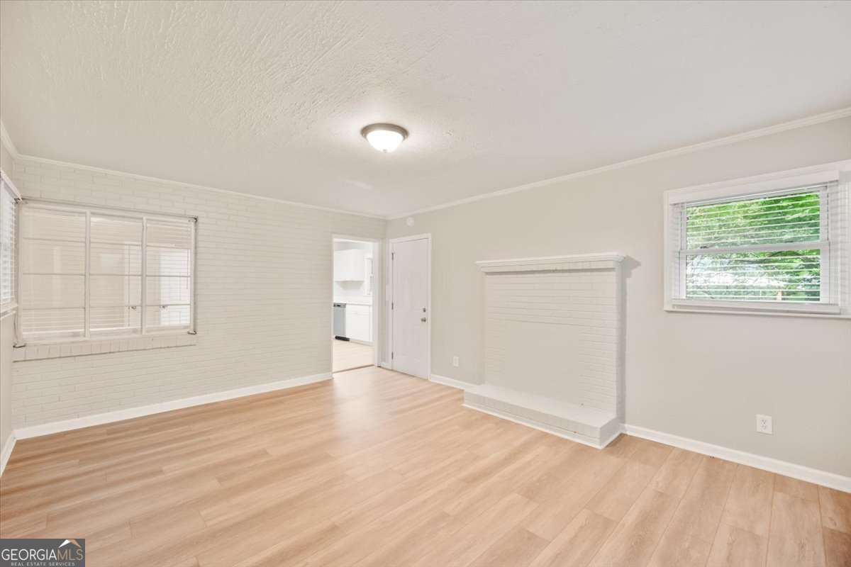 752 Jefferson Avenue Southwest Atlanta, GA 30315 - Photo 13 of 30 an empty room with wooden floor and windows