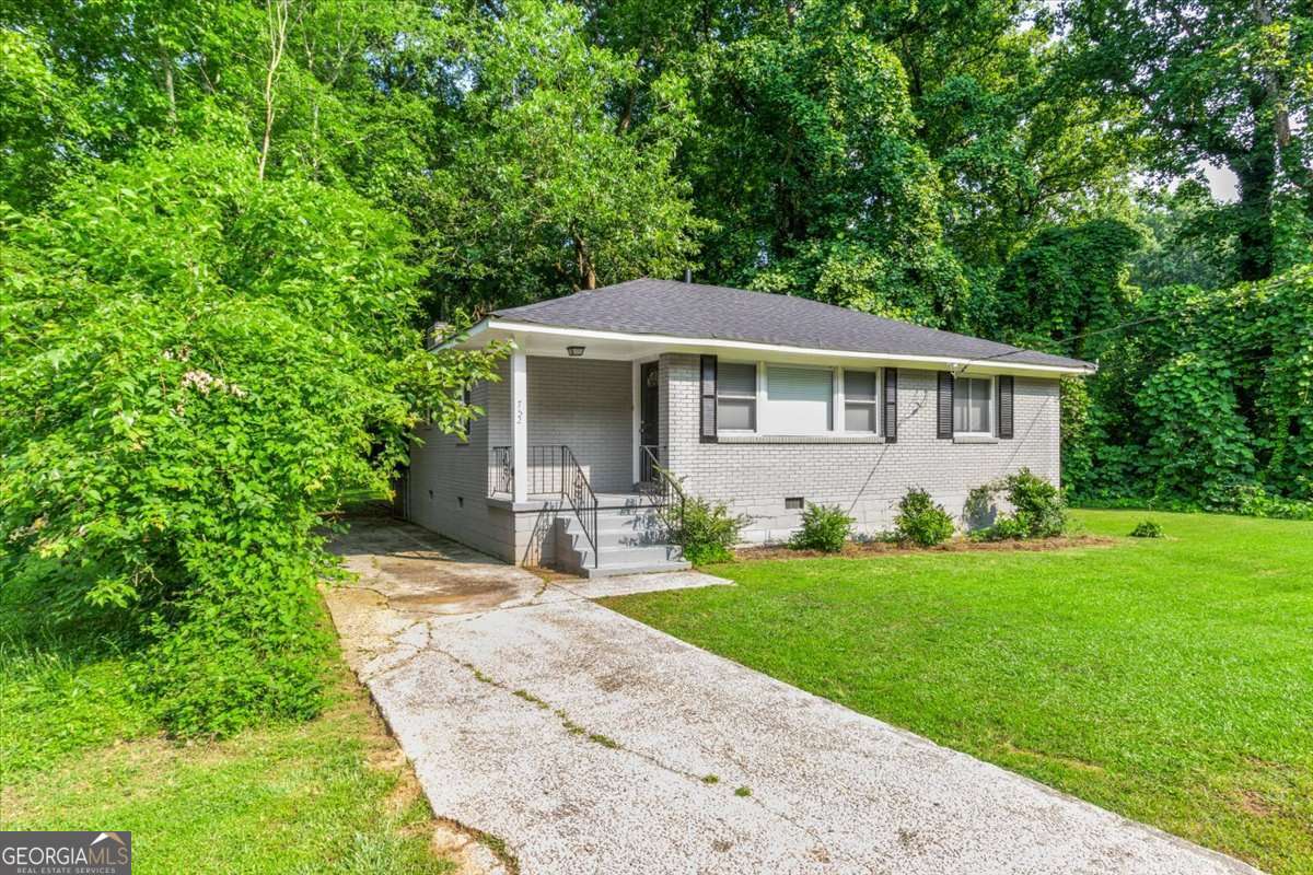 752 Jefferson Avenue Southwest Atlanta, GA 30315 - Photo 2 of 30 a front view of a house with a yard and trees