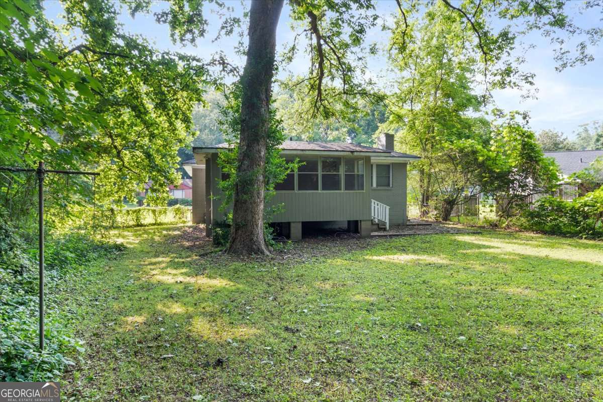 752 Jefferson Avenue Southwest Atlanta, GA 30315 - Photo 28 of 30 a view of a house with backyard and a tree