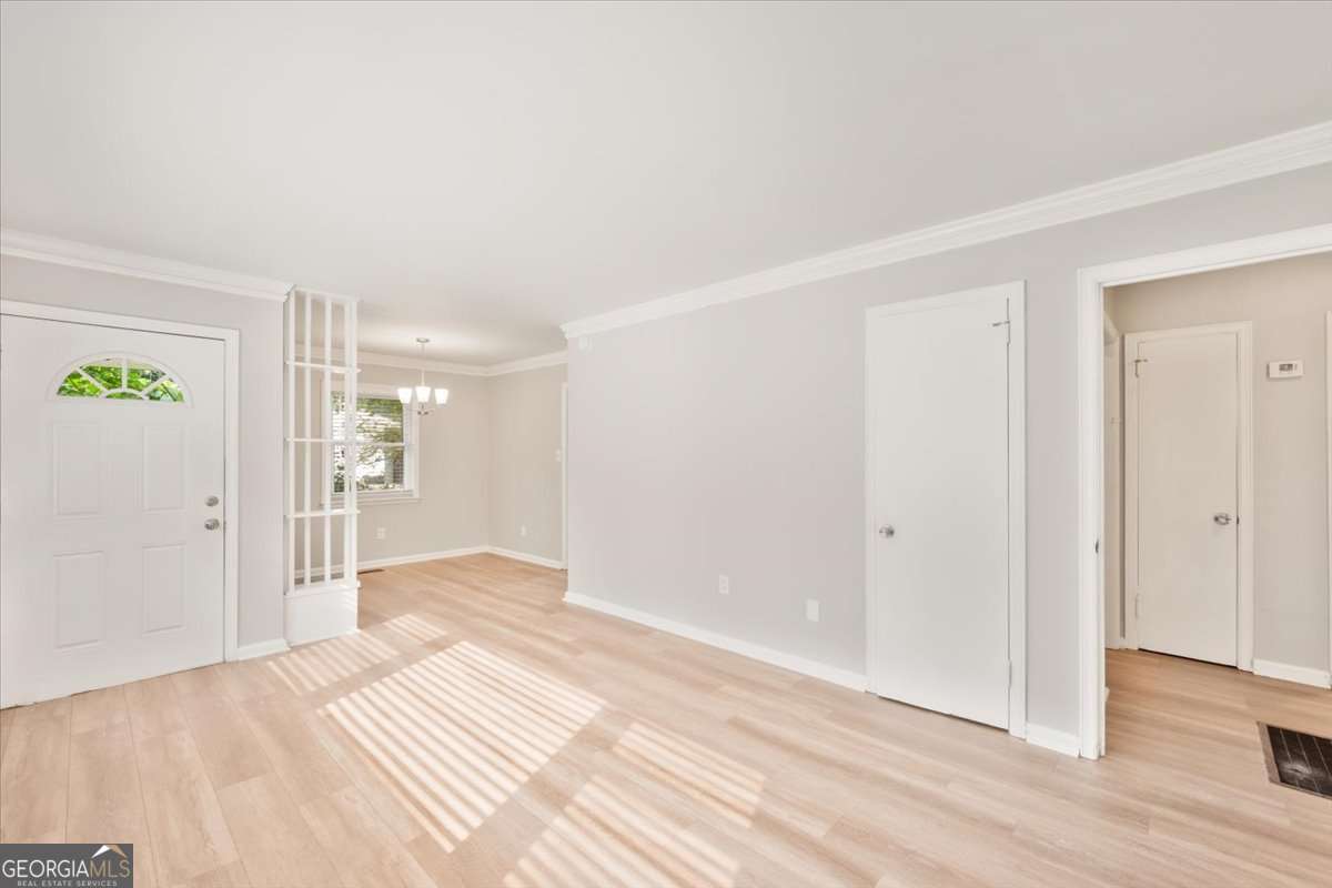 752 Jefferson Avenue Southwest Atlanta, GA 30315 - Photo 4 of 30 a view of a livingroom with wooden floor and closet area