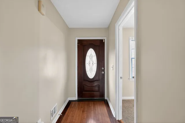 a view of a small space with wooden floor