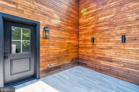 a bedroom with a bed and windows