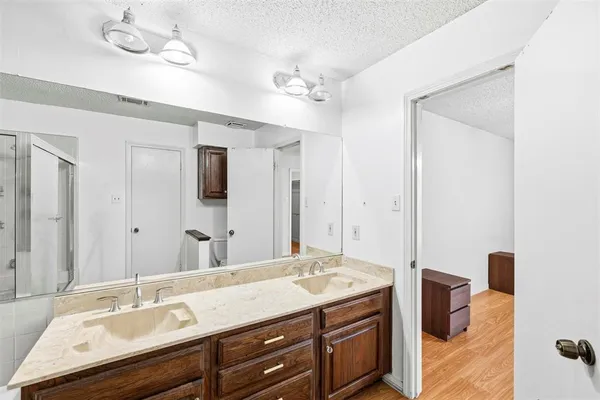 a bathroom with a sink double vanity and a mirror