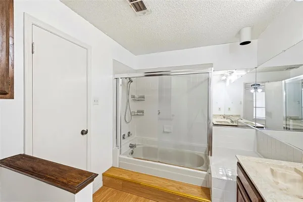 a bathroom with a bathtub and a shower
