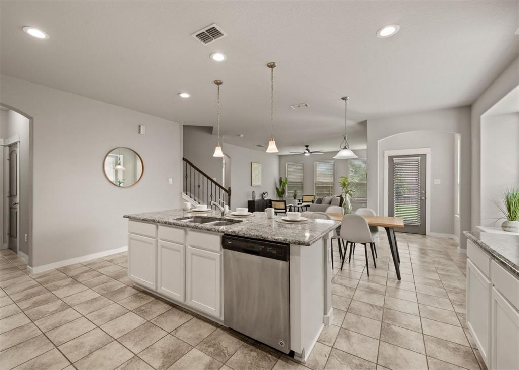 2521 Boot Jack Road Fort Worth, TX 76177 - Photo 14 of 40 a kitchen with stainless steel appliances granite countertop a sink and cabinets
