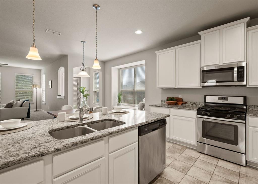 2521 Boot Jack Road Fort Worth, TX 76177 - Photo 15 of 40 a kitchen with sink stove and cabinets