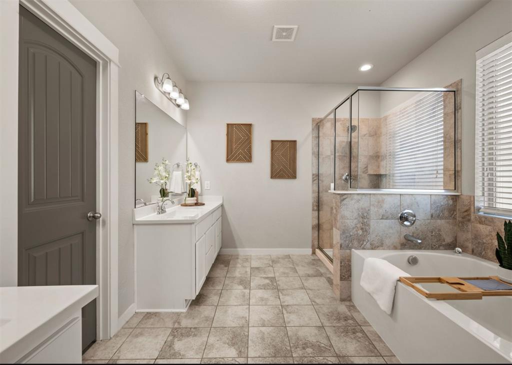 2521 Boot Jack Road Fort Worth, TX 76177 - Photo 21 of 40 a bathroom with a tub sink and mirror