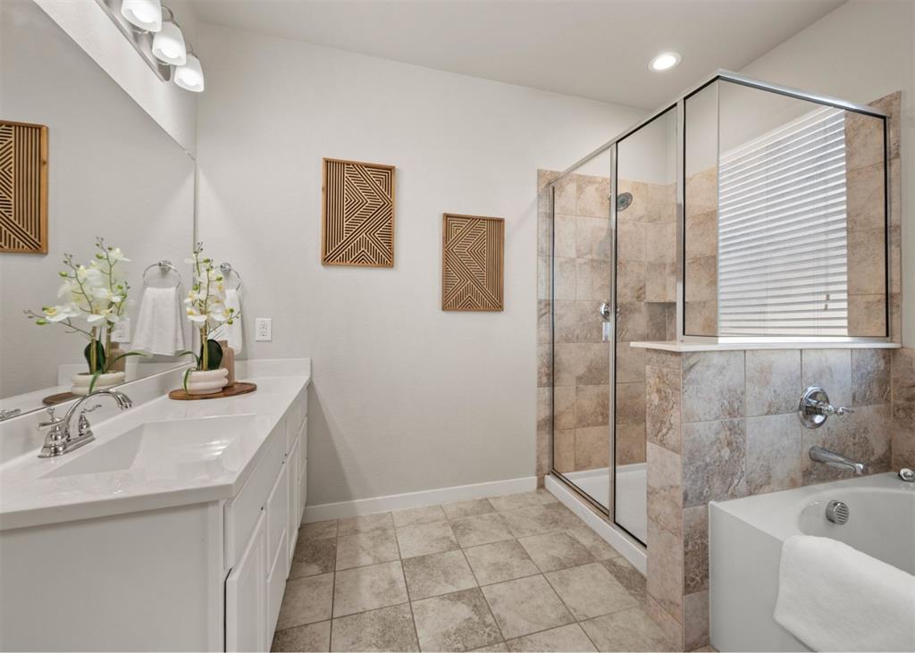2521 Boot Jack Road Fort Worth, TX 76177 - Photo 22 of 40 a bathroom with a sink a toilet and shower