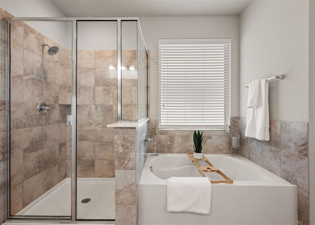 2521 Boot Jack Road Fort Worth, TX 76177 - Photo 23 of 40 a bathroom with a bathtub and a shower
