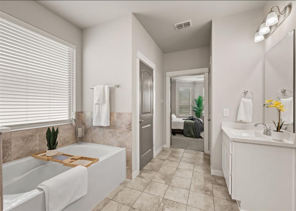 2521 Boot Jack Road Fort Worth, TX 76177 - Photo 24 of 40 a en suite bathroom with a granite countertop tub sink and mirror