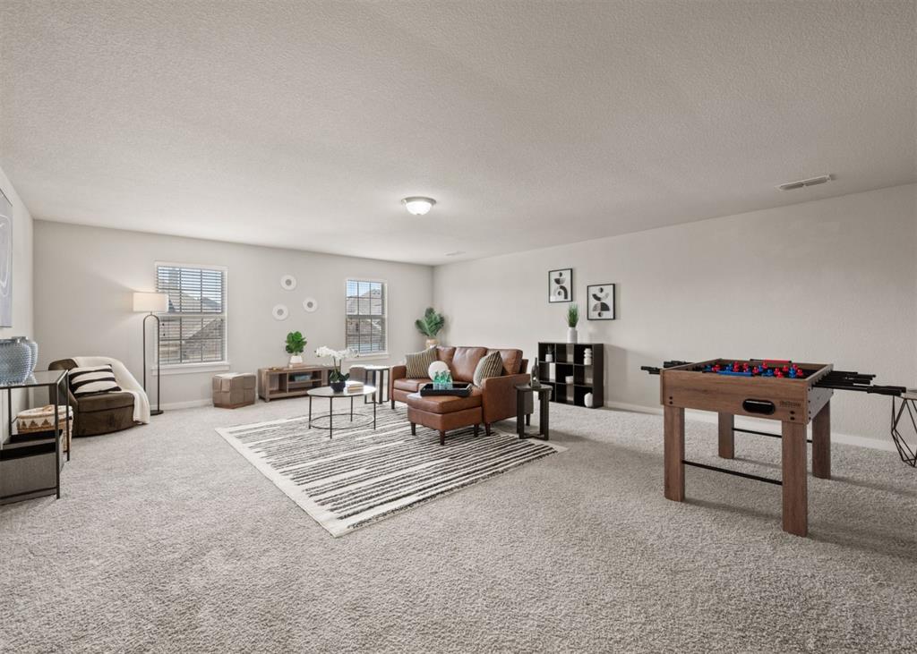 2521 Boot Jack Road Fort Worth, TX 76177 - Photo 25 of 40 a living room with furniture and a couch