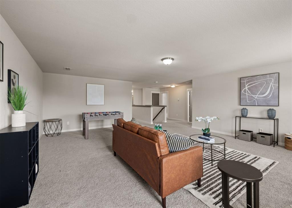 2521 Boot Jack Road Fort Worth, TX 76177 - Photo 26 of 40 a living room with furniture and a potted plant