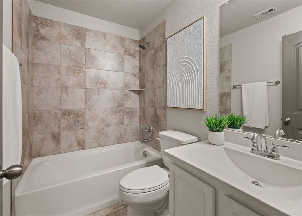 2521 Boot Jack Road Fort Worth, TX 76177 - Photo 31 of 40 a bathroom with a sink toilet and a bathtub