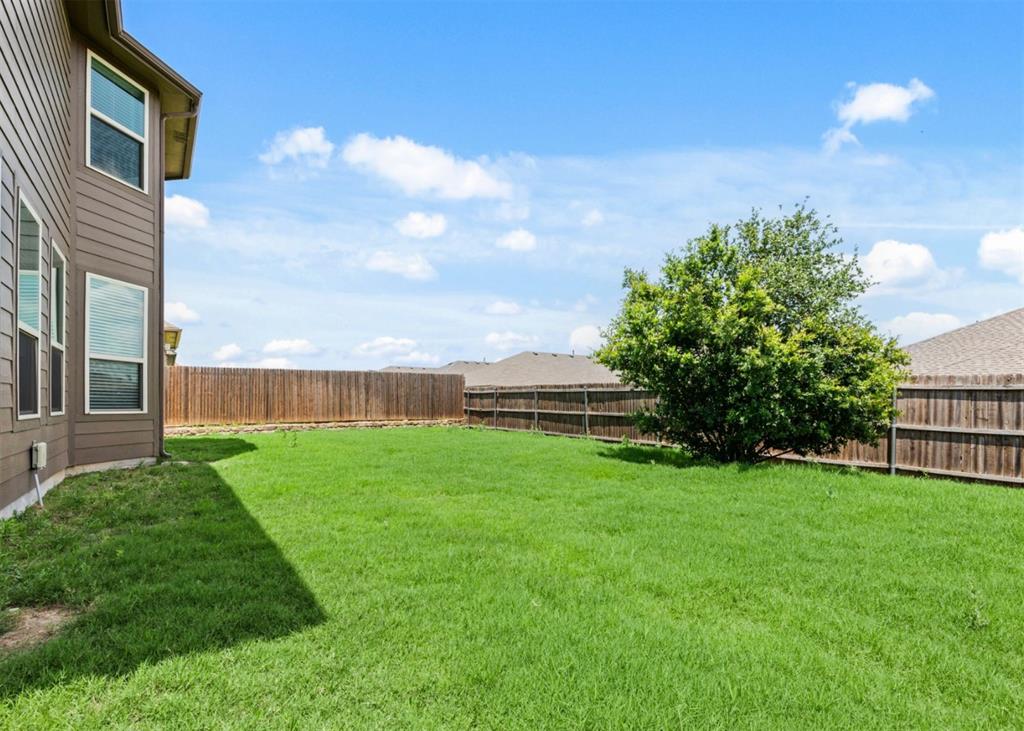 2521 Boot Jack Road Fort Worth, TX 76177 - Photo 37 of 40 a view of a backyard with plants and a garden