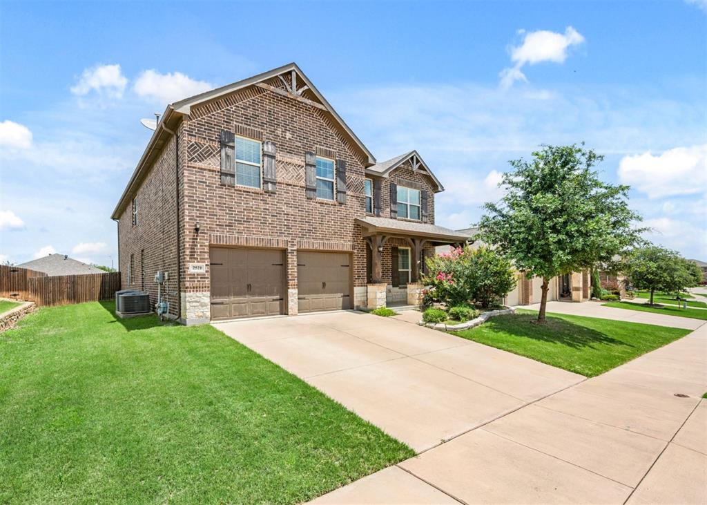 2521 Boot Jack Road Fort Worth, TX 76177 - Photo 6 of 40 a front view of a house with a yard and garage