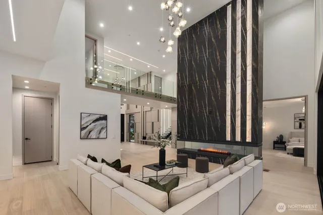 a living room with furniture and a large mirror