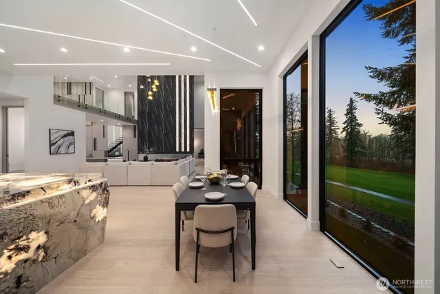 a lobby with furniture and floor to ceiling window