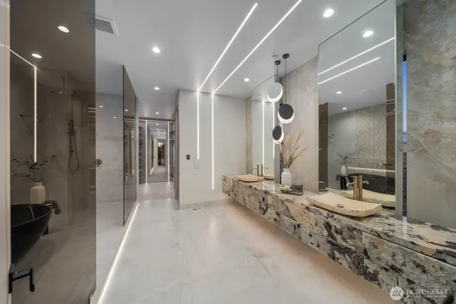 a bathroom with a double vanity sink and a mirror