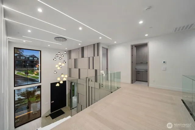 a bedroom with a bed and chandelier