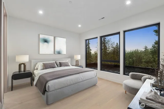 a bathroom with a granite countertop sink a toilet a mirror and shower