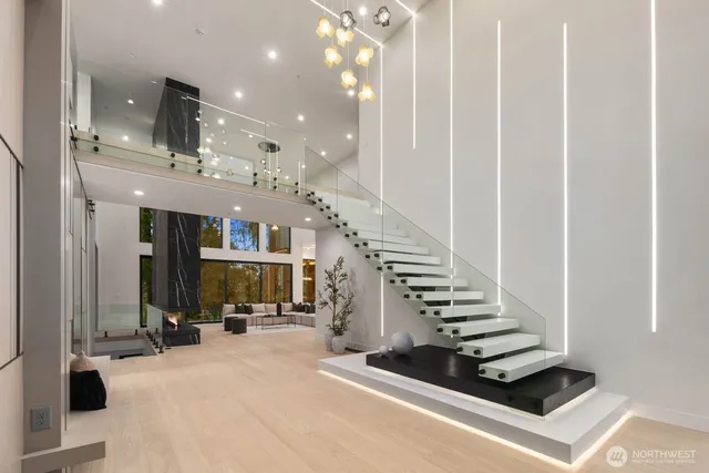 a view of hall and dining room with stairs