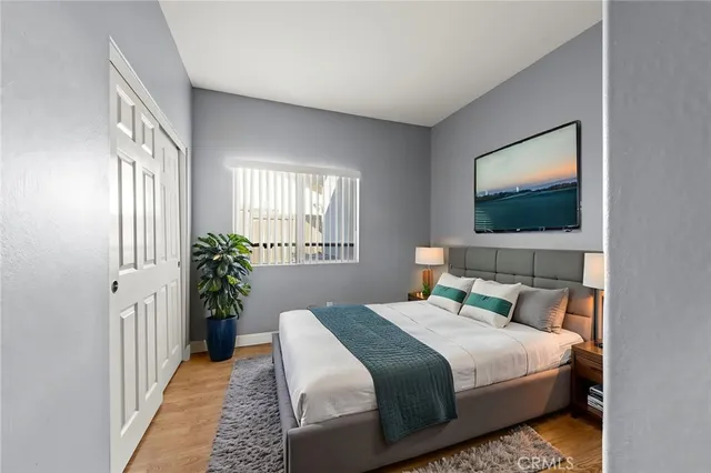 a bedroom with bed and a window