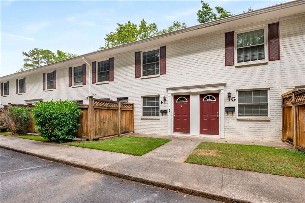771 Jordan Lane, Unit F Decatur, GA 30033 - Photo 1 of 1 a front view of a house with a garden and yard