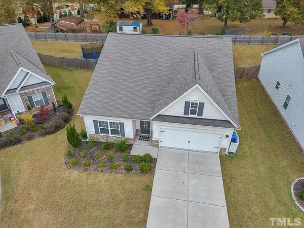 aerial view of a house with a yard