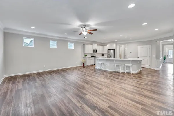 a view of kitchen with cabinets and wooden floor