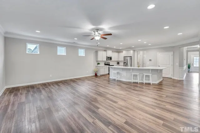 a view of kitchen with cabinets and wooden floor