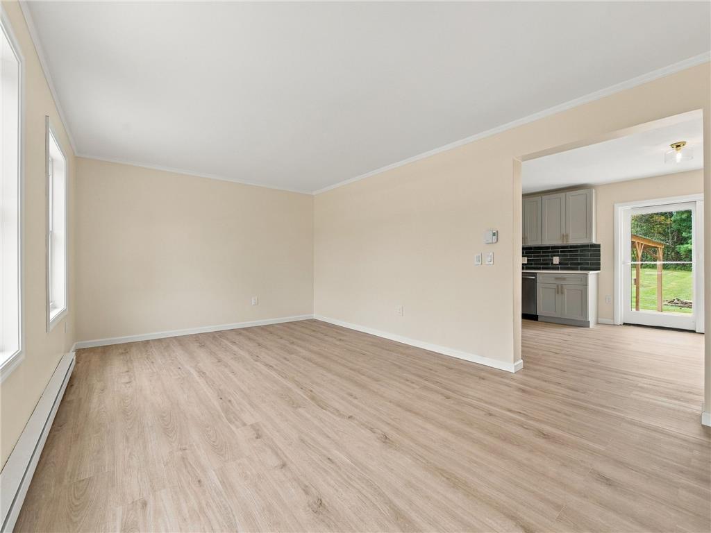 90 Gun Club Road Palmerton, PA 18071 - Photo 25 of 58 Smooth wood-style flooring anchors this spacious layout seamlessly connecting to the kitchen area.